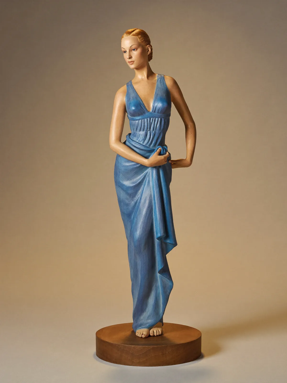 Full Figure tier — standing hand-painted figure on a walnut plinth