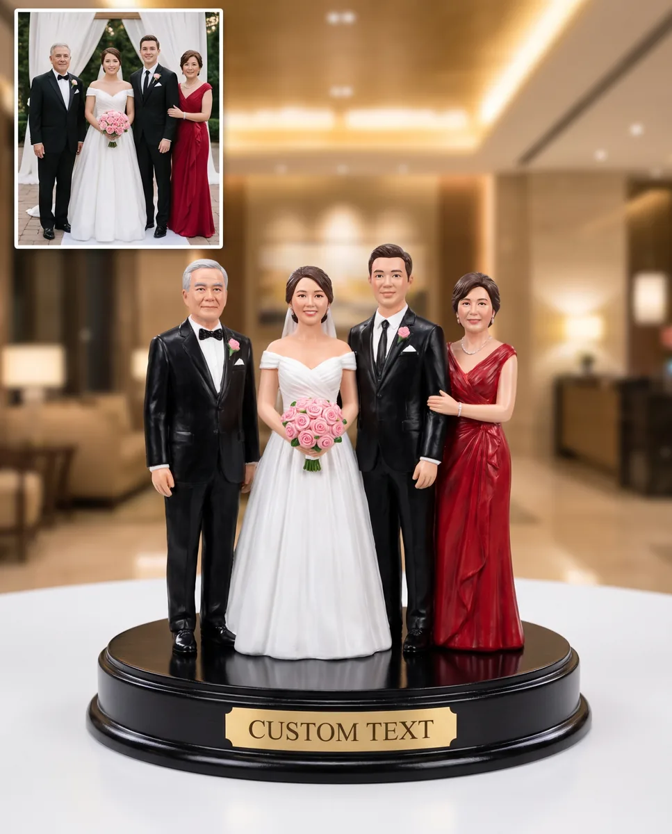 Hand-painted wedding couple sculpture on a black base beside the original wedding photograph it was sculpted from
